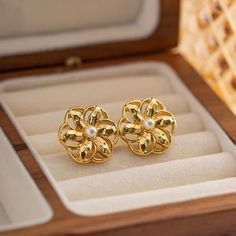 Introducing our stunning Hollow Flower Shaped Stud Earrings, meticulously crafted from durable stainless steel and elegantly adorned with an 18K gold plating. These earrings are a perfect blend of classic charm and modern sophistication, designed to add a touch of glamour to any ensemble. Whether you're attending a wedding, celebrating an anniversary, or simply dressing up for a gala, these earrings are sure to elevate your look. Key Features Material Excellence: Crafted from high-quality stainless steel, ensuring durability and longevity. Luxurious Finish: Enhanced with 18K gold plating for a radiant sheen that captures attention. Waterproof Design: Wear them confidently on any occasion without the fear of damage from water exposure. Hypoallergenic: Free from nickel, lead, and cadmium, ma Gift Gold Flower Earrings Tarnish Resistant, Gold Tarnish-resistant Flower Earrings For Gift, Gold Tarnish-resistant Flower Earrings Perfect For Gifts, Classic Gold Jewelry In Flower Shape, Classic Gold Flower Earrings For Pierced Ears, Elegant Hypoallergenic Metal Flower Earrings, Elegant Gold Hypoallergenic Flower Earrings, Classic Gold Drop Flower Earrings, Tarnish Resistant Gold Plated Flower Earrings