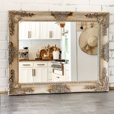 a mirror that is on the side of a wall near a stove top oven and microwave