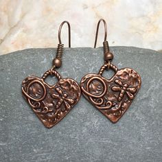 Copper Bohemian heart earrings with rustic charms. Beautifully detailed charms feature dragonflies! Lightweight earrings for casual or dressy occasions. Very pretty and versatile, these earthy minimalist earrings complement any style. Free gift packaging included, earrings are carded and in a gift bag. Customize them with your choice of hypoallergenic ear wires at checkout. To see more of my handmade Bohemian and Czech glass bead earrings, visit this link to my shop: https://www.etsy.com/shop/Je Bohemian Metal Heart Earrings As Gift, Bohemian Style Heart Earrings As A Gift, Cottagecore Jewelry, Copper Heart, Dragonfly Jewelry, Reno Nv, Heart Dangle Earrings, Rustic Jewelry, Handmade Charms