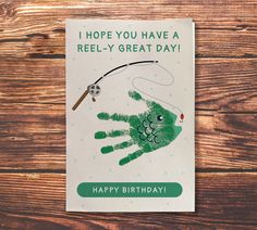 a greeting card with a hand holding a fishing rod and the words, i hope you have a reel - y great day