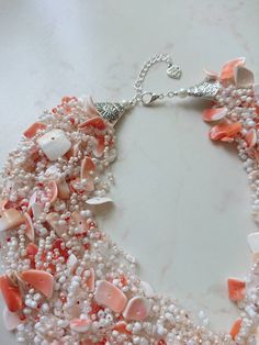 Natural shells necklace, Orange seashell necklace, Mermaid style jewelry, Tropical beach wedding bridal necklace, Crocheted necklace for her. Crocheted natural shells beach party style necklace with your choose of shell chips and glass seed beads. A light, beautiful and flexible piece of jewelry, it will be a great addition to an evening or a wedding gown. It might be a perfect gift for her for a birthday, anniversary or another occasion. Measure: length (flexible): 48 cm (19 inches) + 4 cm chai Elegant Shell-shaped Beaded Necklaces For Beach, White Ocean-inspired Necklace In Mother Of Pearl, Elegant White Strand Beaded Necklaces, Delicate Mother Of Pearl Necklace For Wedding, White Mother Of Pearl Ocean-inspired Necklace, Elegant Beaded Strand Shell Necklace, Elegant Handmade Shell Strand, Elegant Strand Beaded Necklaces As A Gift, Elegant Shell Jewelry For Wedding