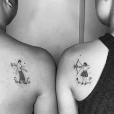 two women with matching tattoos on their backs