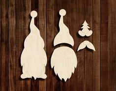 three wooden cutouts of gnomes and trees on a wood background with text overlay