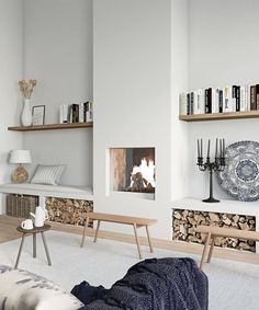 a living room filled with furniture and bookshelves next to a firewood pile