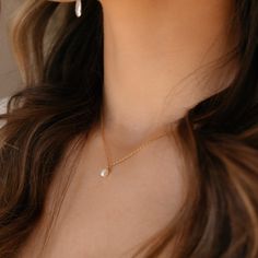 Featuring a delicate pearl and classic gold chain, this timeless piece adds a bit of romantic charm to your look. It's the perfect necklace to make your day just a little more special! DETAILS14k gold fill or sterling silver14", 16", or 18" lengths with a 1" clasp extender chain, Gemstone measures at 0.25"Hypoallergenic and waterproof Classic Gold Charm Necklace With Pearl Drop, Feminine Pearl Charm Necklaces For Anniversary, Everyday Gold Feminine Pearl Necklace, Gold Pearl Necklace For Everyday Feminine Style, Feminine Everyday Gold Pearl Necklace, Everyday Feminine Gold Pearl Necklace, Feminine Pearl Necklace With Delicate Chain, Classic Gold Pearl Chain Charm Necklaces, Classic Gold Charm Necklace With Pearl Chain