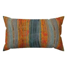 an orange and blue striped pillow on a white background