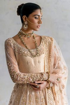 Pakistani Bridal Lehenga with Pishwas Frock and Dupatta is a traditional masterpiece that will give the gorgeous bride a head-turning look at the wedding. Lavish designs and hand-crafted details of zardosi make this beautiful Pakistani Bridal Dress your foremost priority for the big day. Pakistani Bridal Pishwas: Pakistani Bridal Pishwas has an alluring peach color and it comes in premium net fabric. The neckline, panels, and sleeves of this Pishwas Frock are hand-embellished with zardosi and Re Anarkali Style Traditional Drape Wedding Dress, Anarkali Style Wedding Dress For Traditional Ceremonies, Traditional Festive Wedding Dress, Semi-stitched Anarkali Gown For Traditional Ceremonies, Traditional Wedding Dress With Pallu For Festive Occasion, Traditional Wedding Dress With Pallu, Traditional Dresses With Intricate Embroidery For Wedding, Traditional Wedding Dress With Traditional Drape For Festive Occasions, Traditional Drape Wedding Dress For Festive Ceremonies