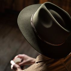 One look at the Jackson will have you dreaming of getting outside, off the beaten trail, and into the wild. Beloved for both its practicality and unique style, it’s the perfect hat to pull on before heading into the unknown. Made from a blend of quality felt and soft merino wool, it’s water-resistant, lightweight, and easy to care for. Dyed in two handsome shades inspired by nature’s warmth — Bronze and Sage ��— it features a subtle pinch-front crown and slender bound-edge brim. At once discreet a Aussie Hat, Getting Outside, Outback Hat, Outdoor Hat, Into The Unknown, Men’s Boots, Casual Bottoms, Outdoor Hats, Denim Outerwear