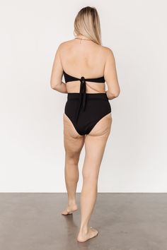 Baltic Born best-seller! Classic Black High waist style bikini bottom Adjustable front wrap tie detail Moderate coverage 80% Nylon, 20% Spandex Hand wash cold Trina is 5'6, cup size 32D, size 2 and is wearing size S Victoria is 5'7, cup size 34D, size 8/10 and wearing size L Beachwear Tankini With Built-in Bra And High Waist, High Waist Swimwear With Built-in Bra For Pool, Fitted Swimwear With Built-in Bra And Tie-side Bottom, Tie-side Bottom Swimwear With Built-in Bra For Sunbathing, Chic Seamless Beach Bottoms, Beach Bottoms With Bra-friendly Tie-side, Beach Bottoms With Tie-sides, Bra Friendly, Beach Bottoms With Tie-side And Bra-friendly Design, Seamless Tie-side Bottoms For Sunbathing