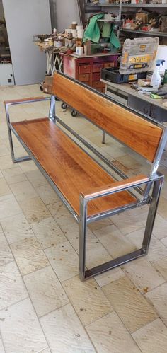 a wooden bench sitting on top of a tiled floor