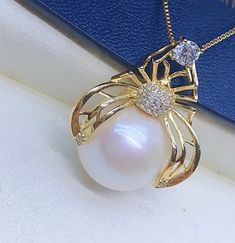 Lovely Big Freshwater White Pearl Pendant, 13.7mm, Bright Creamy White Color with light pink overtone, High Luster.  Sterling Silver S925 with sparkling cubic zircons, Very Well made. Cute Spider Pearl Pendant.  Cute and Lovely   Super Value  Pearl ★ Pearl: Genuine Freshwater White Pearls, Edison ★ Origin: China ★ Size: 13.7mm ★ Shape: Near Round ★ Color: Natural untreated, Bright Creamy White Color with light pink overtone ★ Luster: High Luster ★ Surface: Nice, natural marks, gentle texture, Mo White Rhinestone Round Jewelry, Pearl White Rhinestone Jewelry For Gifts, Fine Jewelry White Rhinestone Jewelry, Fine White Jewelry With Rhinestones, White Fine Jewelry With Rhinestones, White Pearl Jewelry With Prong Setting, Pearl White Round Cubic Zirconia Jewelry, Cute Spider, Creamy White