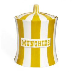 a yellow and white striped canister with the word munchies on it