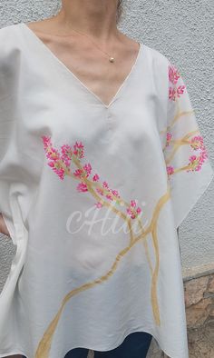 Limited, unique, hand painted silk-viscose tunic with pink Bougainvillea. You will be special wearing this clothes. The item made of silk-viscose fabric, it is pleasant to wear in the summer heat. Hand painted and sewing by me.  Dry-cleanable or handwash only and please don't tumble dry! Handmade item. There is a seam on both side. You can see in the last picture all windths and lengths. The whole length is 70 cm. If you have any questions, please contact me. https://www.instagram.com/p/C8oW6O3o Spring Silk V-neck Kaftan, Silk Summer Tops With Floral Embroidery, Summer Tunic With Printed Kimono Sleeves, Spring Silk Kaftan, White Silk Kaftan For Spring, Silk Beach Tops For Spring, Silk V-neck Tunic For Summer, Silk Tops For Beach In Spring, Silk V-neck Spring Kaftan