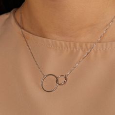 Dimensions Larger circle diameter - 17mm Smaller circle diameter - 13mm Necklace Length: 40 + 5cm (15.7 + 1.9inch) 45 + 5cm (17.7 + 1.9inch) 50 + 5cm (19.6 + 1.9inch) Silver necklace with intertwined circles. The elegant chain style will perfectly accentuate your neck and collarbone. With a simple yet luxurious design, this pendant can easily complement any look, giving it completeness and accent. Materials and designs give a special shine to this piece that will beautify you. As a present Jewel Nickel-free Chain Necklace With Round Pendant, Nickel-free Round Chain Necklace, Nickel-free Round Disc Charm Necklace, Minimalist Stainless Steel Chain Necklace, Adjustable Chain Necklace With Open Circle, Metal Necklace Full Circle For Gift, Metal Full Circle Necklace For Gift, Everyday Round Metal Charm Necklaces, Nickel Free Adjustable Round Chain Necklace