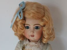 The Daisy style wig is the classic German wig found on the popular Kestner 171 Daisy doll and many other German dolls. This wig has a side part with bangs pulled back in a bow with two staggered rows of soft ringlet curls surrounding the head. Made of the finest quality mohair. The colors resemble those of the original antique dolls. This wig is sure to enhance the beauty of your antique doll when only the best will do Bangs Pulled Back, Side Part With Bangs, Pull Back Bangs, Ringlet Curls, Style Wig, Doll Wig, German Dolls, Doll Wigs, Dark Blonde