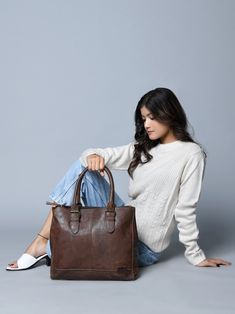 Introducing the City Chic Brown Leather Shoulder Tote—a versatile office bag designed for elegance and practicality. With a central compartment, inside pocket, and sturdy handles adorned with stylish buckles, it seamlessly blends class with functionality. Crafted from naturally tanned buffalo leather, this bag effortlessly transitions from office sophistication to casual chic. Perfect for brunch or quick outings with friends, it complements your style while prioritizing environmental responsibil Timeless Everyday Tote Briefcase, Everyday Timeless Tote Briefcase, Business Leather Backpack With Double Handle, Everyday Leather-lined Satchel Briefcase, Leather Satchel Briefcase With Handle Drop, Everyday Soft Leather Top Handle Briefcase, Everyday Leather Briefcase With Double Handle, Everyday Top Handle Soft Leather Briefcase, Leather Shoulder Bag Briefcase With Handle Drop