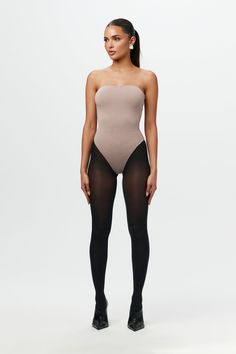 Far from basic. Our form-conscious bodysuit features a straight neckline and our signature double-lined fabric for a close, comfortable fit that won’t slip or chafe. Finished with a thong back and snap closure for seamless styling versatility. NW Collection Import 95% Viscose, 5% Spandex Model wears size X-Small True to size This bodysuit is double-lined All Bodysuits Are Final Sale Basic Bodysuit, Naked Wardrobe, Womens Bodysuit, Denim Pants, Jumpsuit Dress, Final Sale, Your Style, Comfort Fit, Shop Now