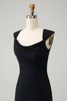 a black dress on a mannequin dummy