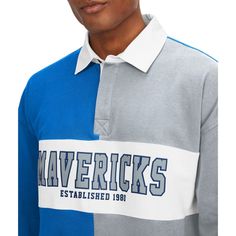 Upgrade your rotation of official Dallas Mavericks gear with this Ronnie Rugby Long Sleeve T-Shirt from Tommy Jeans. Not only does it feature an embroidered applique of the team's logo on the chest, but there is an additional logo behind the collar in a small contrast-color section. The three-button placket makes this long sleeve top the perfect option for formal and informal Dallas Mavericks events. Embroidered fabric applique Officially licensed Machine wash, tumble dry low Material: 100% Cott Collegiate Gray Crew Neck Top, Gray Collegiate Crew Neck Top, Gray Varsity Top For College, Sporty Gray Color Block Tops, Heather Grey Graphic Print Top For College, Gray Varsity Cotton Top, Gray Cotton Varsity Top, Sporty Heather Grey Tops For College, Fabric Applique