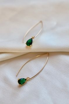 Featuring gold threader earrings and a stunning emerald teardrop drop, our Emerald Teardrop Earrings are the epitome of elegance. Elevate any outfit with these timeless and luxurious earrings, perfect for any occasion. Add a touch of sophistication to your jewelry collection with these beautiful earrings. SKU: E1643EMG Materials: Emerald Wedding Earrings, Emerald Green Jewelry, Gold Threader Earrings, Luxurious Earrings, Teardrop Earrings Gold, Threader Earrings Gold, Luxury Earrings, Green Jewelry, Christmas Vibes