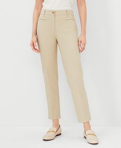 Elevate your wardrobe with the sophisticated charm of Ann Taylor's Cotton Crop Pant in Soft Khaki. These tailored and fitted pants are designed to flatter with a slim leg that's slightly cropped just above the ankle, creating perfect proportions for any occasion. 

- Size: 14 Regular
- Color: Soft Khaki
- Material: 97% Cotton, 3% Spandex
- Gender: Female
- Fit: Tailored and fitted
- Rise: Mid-rise, sits 2 1/4" below natural waist
- Length: Hits above the ankle; 26" inseam with 14 1/2" leg openin Stretch Cropped Pants With Belt Loops, Casual Tailored Cropped Leg Pants, Cropped Leg Dress Pants With Pockets For Business Casual, Casual Tailored Cropped Pants, Tailored Cropped Leg Bottoms With Pockets, Tailored Bottoms With Pockets And Cropped Leg, Tailored Cropped Pants With Welt Pockets, Cropped Leg Dress Pants For Spring, Fitted Pants With Welt Pockets And Cropped Leg