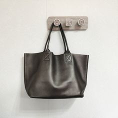 Overview:Design: Handmade Vintage Tote BagIn Stock: Made to order (4-7 days)Include: Tote + A detachable Side InnerCustom: NoColor: 6 ColorsLeather: Head Layer CowhideMeasures: 33cm x 30cm x 15cmWeight: 0.75 kgSlots: 1 slotAccessories(option): NoStyle: Tote Bag, Shoulder bag, Handbag, Shopper bagVery durable (At least 5 Years) and it should last a life timeNote:Each item will have very slight variances to the pictured item, and the consequence is that you can assure that each one is unique. The Smooth Grain Crossbody Bag For Shopping, Solid Leather Shoulder Bag For On-the-go, Everyday Faux Leather Shoulder Bag With Smooth Grain, Everyday Use Faux Leather Shoulder Bag With Smooth Grain, Solid Color Leather Tote Shoulder Bag, Leather Shoulder Bag With Smooth Grain For Errands, Travel Bags In Smooth Grain Faux Leather, Solid Leather Bags With Removable Pouch, Rectangular Shoulder Bag With Smooth Grain For Errands