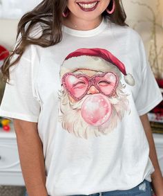 The Vintage Santa With Sunglasses Graphic Shirt is a trendy twist on a classic holiday look! This shirt showcases a cool, retro Santa face wearing sunglasses, blending vintage charm with modern flair. It's perfect for adding a fun, laid-back vibe to your Christmas wardrobe. Available in short sleeve, long sleeve, and sweatshirt styles, it’s ideal for cozying up during the festive season. Offered in sizes YXS to 5XL, this shirt is great for the whole family. Celebrate Christmas in style with this unique and festive Santa design! Vintage Christmas Shirts, Sunglasses Graphic, Vintage Christmas Shirt, Christmas Wardrobe, Santa Tee, Retro Santa, Wearing Sunglasses, Santa Face, Vintage Santa