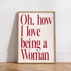 a white framed poster with the words oh, how i love being a woman on it