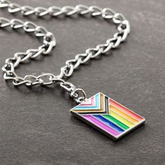 Find the Progress Pride Flag Charm by Bead Landing™ at Michaels. Create fun, playful accessories using this Progress Pride flag charm from Bead Landing. This piece will look great added to a bracelet or grab a second matching charm to make an eye-catching pair of earrings. Create fun, playful accessories using this Progress Pride flag charm from Bead Landing. This piece will look great added to a bracelet or grab a second matching charm to make an eye-catching pair of earrings. Details: Multicol Trendy Jewelry For Pride Gifts, Progress Pride Flag, Bead Landing, A Bracelet, Pride Flag, Pride Flags, Looks Great, Flag, Bracelet