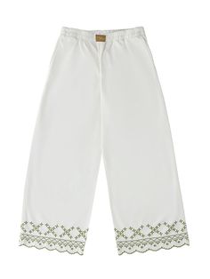 A lightweight pant with a relaxed fit, perfect for pairing with the matching Sophie Shirt or wearing on its own. Whether you're dressing up for a holiday away, or going for a more relaxed look, this pant is ideal for versatility and comfort. This is a relaxed fit trouser, if you would like a smaller fit please size down. Elasticated waist. Embroidered hem. Pockets. Nadia is 170cm and a size UK 6/8. She is wearing a S. Fabric & Care: Made with 95% certified organic cotton and 5% recycled cotton, all helping to reduce its carbon footprint and water consumption. Chic Summer Pull-on Style Pants, Relaxed Cotton Bottoms For Vacation, Ankle-length Pull-on Pants For Loungewear, Relaxed Cotton Pants For Vacation, Wide-leg Pants With Elastic Waistband For Daywear, Relaxed Fit Wide Leg Pants With Pull-on Style, Relaxed Cotton Wide-leg Bottoms, Relaxed Cotton Wide-leg Pants, Relaxed Cotton Harem Pants With Straight Leg