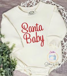 Santa Baby Christmas Sweatshirt/Sweatshirt Bubble Monogrammed/Christmas Infant Sweater/Christmas Crewneck/Embroidered Sweatshirt/Pictures Please note that colors may vary slightly due to lighting and/or your computer monitor settings. I do my best to provide an accurate representation of colors. This listing is for the Sweatshirt Only and doesn't include any photo props. Please be sure to leave the name and number needed in the 'notes to seller' section at checkout.  If you want to change the color scheme just message me before placing your order. All embroidered items are finished with a soft backing to protect sensitive skin from scratchy stitches.   *Wash inside out on cold gentle cycle and hang to dry. Do not use bleach. Iron inside out on low heat without steam.   *CURRENT PRODUCTION Embroidered Long Sleeve Christmas Sweatshirt, White Christmas Tops With Embroidered Graphics, Christmas White Embroidered Tops, White Top With Embroidered Logo For Christmas, White Tops With Embroidered Logo For Christmas, Embroidered Christmas Holiday Sweatshirt, Christmas Holiday Embroidered Sweatshirt, White Tops With Custom Embroidery For Christmas, Long Sleeve Embroidered Tops For Holiday