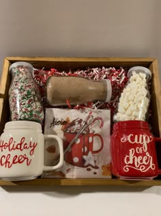 the holiday cheer gift box includes mugs, hot chocolate, marshmallows and candy canes