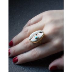 A reminder that sunny days are on the horizon, this ring is carefully handcrafted from 18k gold over silver featuring a cowry marked with a turquoise bead. Style it with its matching layered necklace from the Marina collection. Handmade from 18-karat Yellow Gold Over Sterling Silver (1 micron plating). We suggest to avoid contacts with soaps, detergents, chlorine and any other chemical substance that could alter the original characteristics of your jewel. When it is not worn, keep your jewelry p Minimalist Beach Jewelry Ring, Minimalist Beach Ring Jewelry, Adjustable Turquoise 14k Gold Jewelry, Adjustable 14k Gold Turquoise Jewelry, Everyday 14k Gold Turquoise Jewelry, Everyday Turquoise 14k Gold Jewelry, Bohemian 14k Gold Gemstone Jewelry, Adjustable Gold Turquoise Ring Fine Jewelry, Adjustable Gold Turquoise Ring In Fine Jewelry Style