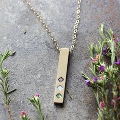 "Our Gold Bar Necklace with birthstones is delicate and meaningful. Each birthstone represents a child, grandchild or loved one. The necklace comes with 2, 3, 4, 5 or 6 birthstones. It's the perfect family necklace or mother's birthstone necklace! This design is also available in ROSE GOLD and SILVER at these listings!: Rose Gold: https://www.etsy.com/listing/514202081 Silver: https://www.etsy.com/listing/524727425 ♥♥ HOW TO ORDER ♥♥ PLEASE READ * IF WE DO NOT RECEIVE THE FOLLOWING INFO YOUR ORD Customizable Gold Birthstone Necklace For Mother's Day, Elegant Gold Multi-stone Birthstone Necklace, Mother's Day Gift: Round Birthstone Necklace, Mother's Day Gold Birthstone Necklace, Nickel Free, Birthstone Necklace Mothers, Family Birthstone Necklace, Vertical Bar Necklace, Family Necklace, Gold Bar Necklace