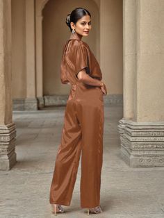 This soft satin jumpsuit features a flattering v-neck design, making it the perfect choice for mothers of the bride. Its dress pantsuit style provides comfort and elegance, while its high-quality material ensures a polished look. Stay stylish and comfortable on that special day with our jumpsuit. Dress Pantsuit, Satin Jumpsuit, Belt Jumpsuit, Peacock Green, Mother Of The Bride Dress, Dress With Belt, Mother Of The Bride Dresses, Different Fabrics, Elegant Dress