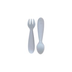 two plastic utensils sitting next to each other on a white surface with one fork and the other spoon