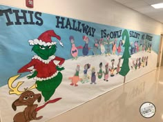 this is an image of a hallway decorated with christmas decorations and cartoon characters on it