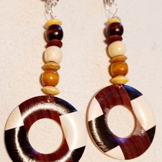 These Are Unique And Natural Natural Wood 100% Handmade Silver Metal Clip On Closure They Hang 4 Inches These Are Very Lightweight On The Ear Easy To Wear They Are One Of A Kind These Earrings Are A Classic And Timeless Addition To Any Wardrobe *All Handpainted Designs Are Original And May Slightly Differ Due To Artistic Originality Bohemian Brown Round Earrings, Brown Bohemian Round Earrings, Traditional Brown Round Earrings, Unique Brown Round Earrings, Traditional Brown Jewelry For Summer, Summer Traditional Brown Jewelry, Handmade Brown Earrings For The Beach, Handmade Circular Brown Jewelry, Handmade Brown Earrings For Beach