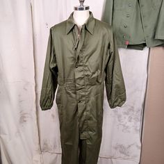 Great pair of US Army coveralls...cold weather mechanics coveralls from 1983. Features include: Nylon lining on the top portion Elastic gathered cuffs and pant legs Large rear pocket with Ideal zipper Heavy zipper front enclosure with snaps on the overlapping flap Built in elastic waistband Condition is very good. The fabric is free of holes and fraying and seems quite new. There are some white stainssee pic.  Please see all the pics to make the best decision on condition and look.  Men's size Medium Military Style Long Sleeve Cotton Jumpsuit, Military Style Long Sleeve Cotton Jumpsuits And Rompers, Military Style Long Sleeve Khaki Jumpsuit, Khaki Military Long Sleeve Jumpsuit, Khaki Military Style Long Sleeve Jumpsuits, Khaki Long Sleeve Utility Overalls, Military Overalls With Pockets For Outdoor, Long Sleeve Overalls With Pockets For Outdoor, Ariat Cowboy Boots Women