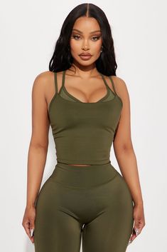 Available In Black And Olive. Active Top V Neck Sleeveless Elevate Mesh Panel Detail Racerback Medium Impact Pair With "Claudia Elevate Active Legging" Self 1 73% Polyester 27% Spandex Self 2 82% Nylon 18% Spandex Inner Mesh 82% Nylon 18% Spandex Imported | Carmen Elevate Active Top in Olive Green size Medium by Fashion Nova