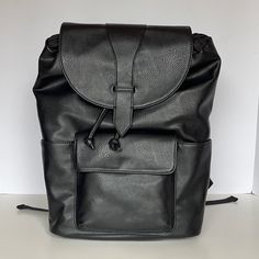 This Backpack Is Brand New With Tags And Has Never Been Used. This Women’s Black, Faux Leather Backpack Has A Drawstring Closure With A Flap That Snaps. The Straps Are Adjustable, Is Has Side Pockets Perfect For A Water Bottle And It Has A Pocket That Snaps Closed In The Front. This Backpack Is 14.5” X 10” X 4.5”. Message Me With Questions! Casual Black Faux Leather Backpack, Black Faux Leather Rectangular Backpack, Black Rectangular Faux Leather Backpack, Black Faux Leather Backpack With Adjustable Strap, Black Faux Leather Backpack For Travel, Black Faux Leather Backpack For School, Black Faux Leather Travel Backpack, Black Faux Leather Satchel Backpack, Black Faux Leather School Backpack