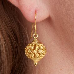 A beautiful romantic minaret filigree gold ball drop earring. These gold earrings are a crossover between boho and ethnic, but have an antique flavour that I love. Reminiscent of hot days in Morocco or an Indian Summer, I love the romance of these beautiful gold drops.  Dangly and fun, the intricate gold work and filigree has been worked by hand to create these atmospheric gold  ball drop earrings. You can wear these with flowing skirts, jeans and t-shirt , or all in white. The gold has a shine, but also a matt finish and really pops in the sunlight. All the materials I use are real Sterling Silver and 18 carat gold. I do not use inferior metals such as Gold fill or Brass Gold plated! Perfect for everyday, satisfyingly heavy, but light and easy to wear. These can be matched with anything i Gold Plug Earrings For Festive Celebration, Festive Gold Plug Earrings For Celebration, Festive Celebration Gold Plug Earrings, Festive Yellow Gold Earrings For Gift, Ornate Gold Earrings For Festive Occasions, Festive Gold Plug Earrings As Gift, Festive Gold Plug Earrings Gift, Festive Gold-plated Gold Earrings, Yellow Gold Festive Earrings