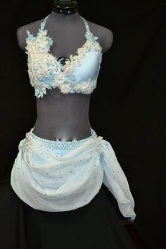 a mannequin wearing a blue and white bra with lacy trims on it