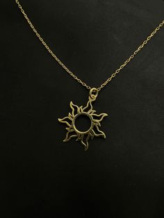 Sun Design Necklace: Carry the Energy and Radiance of Nature with You! Inspired by the warm rays of the sun, this unique necklace captures attention with its distinctive design. Standing out with its elegant details and delicate craftsmanship, this necklace symbolizes the energy of the sun and the essence of life. Radiant and chic in every aspect, this necklace, with its graceful details representing the sun, complements every outfit. Sparkling under the natural light of the sun during the day, it completes your elegance in the evening. Whether on special occasions or for daily wear, this sun design necklace is an ideal choice for those who appreciate uniqueness. Enjoy expressing yourself and carrying the beauty of nature with this sun design necklace. Add a touch of radiance to your style Solar Eclipse Necklace, Sun Amulet, Sun Minimalist, Sun Jewelry, Sun Solar, Necklace Sun, Solar Design, Rays Of The Sun, Sun Design