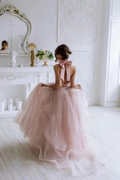 Introducing the enchanting Gwenevere Ruffled Tulle & Satin Flower Girls Dress, a masterpiece designed to transform any special occasion into a fairy tale. This exquisite dress is crafted with the utmost attention to detail, featuring a smooth satin halter neckline that cascades into a mesmerizing sea of ruffled tulle, ensuring your little angel feels nothing short of a princess. The pièce de résistance? An oversized, decorative satin bow at the back of the neck, adding a touch of grandeur and so Baby Christening Outfit, Flower Girls Dress, Girls Communion Dresses, Satin Flower Girl Dress, Wedding Party Flowers, Pink Flower Girl Dresses, Girls Crown, Flower Girl Crown, Girls Pageant Dresses