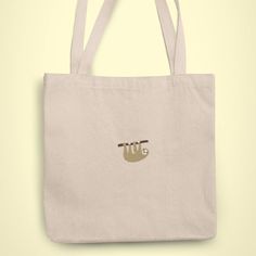 Sloth Tote bag. 100% Combed Organic Cotton. As the bag is organic cotton, it might be slightly different colour to the photo. 100% vegan. Beige Bags With Embroidered Logo For Daily Use, Casual Embroidered Canvas Bag For Daily Use, Embroidered Canvas Bags For Daily Use, Beige Canvas Bag With Embroidered Logo For Everyday Use, Everyday Beige Canvas Bag With Embroidered Logo, Embroidered Beige Canvas Bag For Daily Use, Everyday Embroidered Canvas Shoulder Bag, Beige Embroidered Canvas Bag For Daily Use, Casual Embroidered Natural Bag