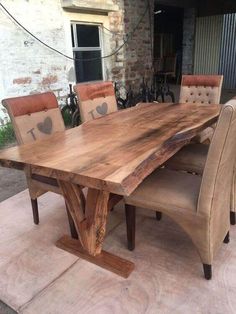 a large wooden table with chairs around it