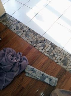 a bathroom floor that has been cleaned and is being worked on