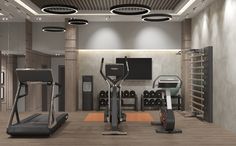 there is a gym with treadmills and exercise equipment in the middle of it