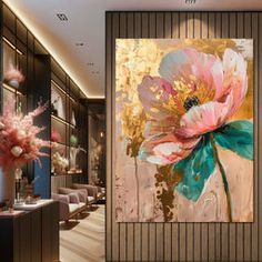 a large flower painting on the wall next to a vase with pink flowers in it